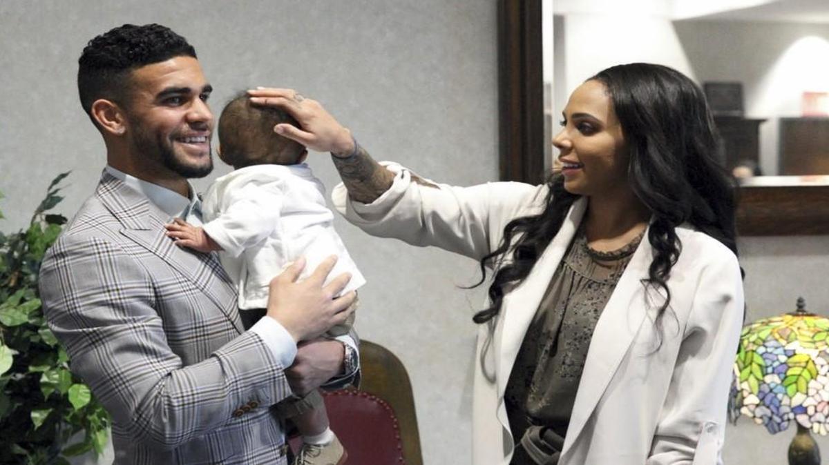 In this photo provided by Sporting Kansas City and taken March 16, 2017, from left to right, Dom Dwyer, infant son Cassius and wife Sydney Leroux gathered for Dwyer’ss naturalization ceremony at Charles Evans Whittaker Courthouse in Kansas City, Mo.