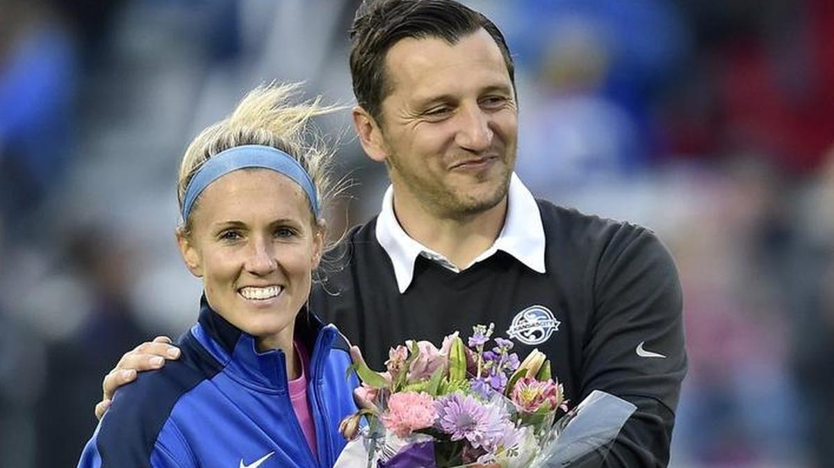 In a file photo from 2016, then-FCKC coach Vlatko Andonovski presents flowers to Jen Buczkowski during a ceremony commemorating her career and retirement from pro soccer.