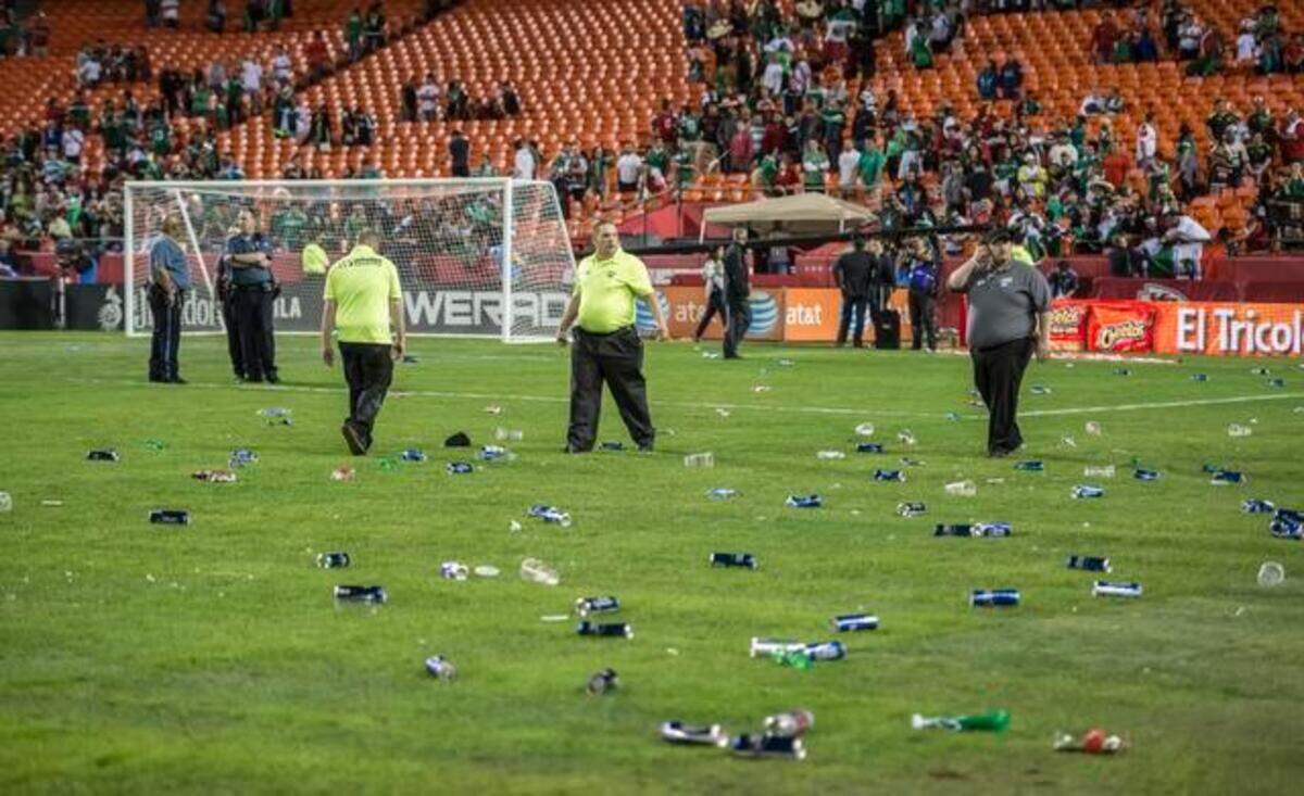 Cans of beer and bottles were strewn across the playing field after fans ran onto the playing field following the exhibition soccer match between Mexico and Paraguay on March 31, 2015 at Arrowhead Stadium in Kansas City, Mo.
