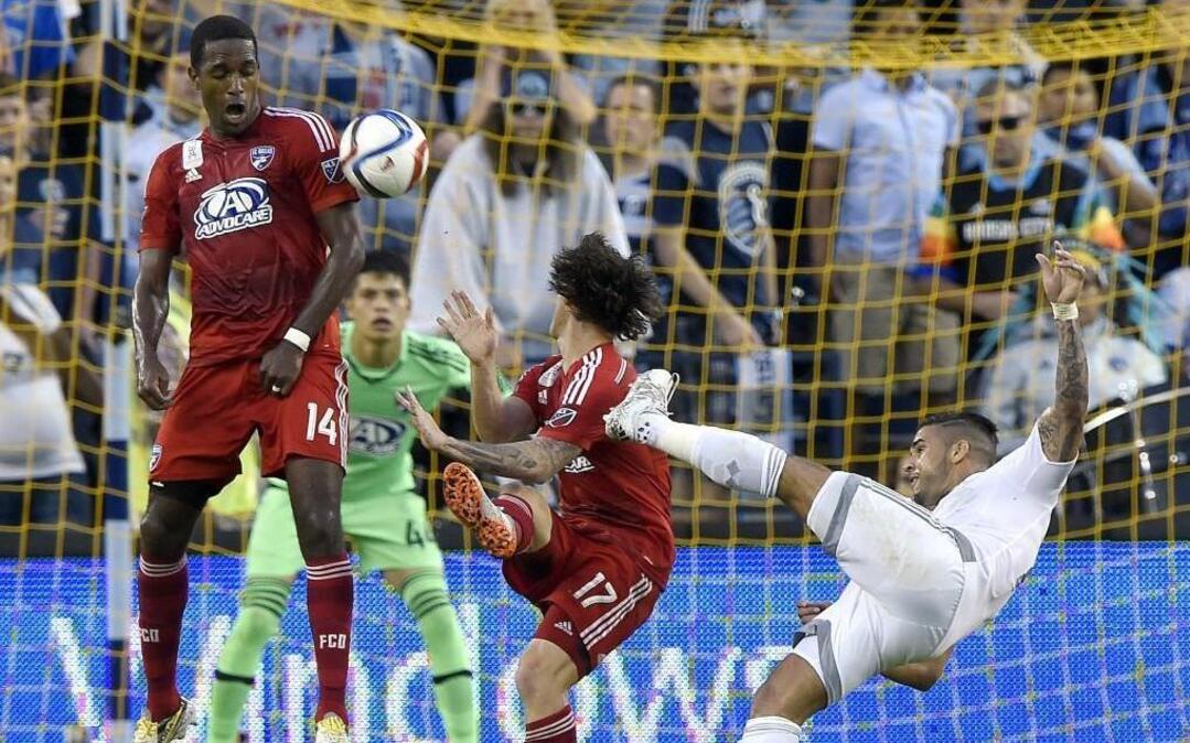 
Sporting KC forward Dom Dwyer (from right) tried for a goal in front of FC Dallas defender Zach Loyd and midfielder Atiba Harris on Friday at Sporting Park.



