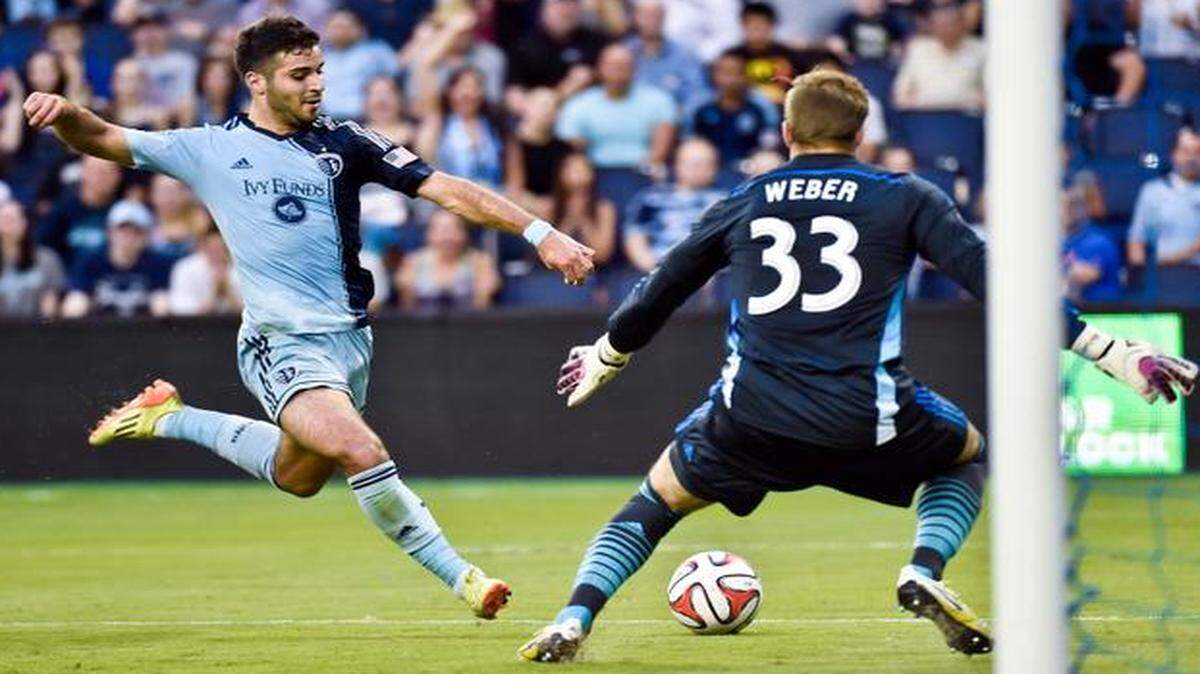 
Sporting KC forward Soony Saad (22) attempts a goal near Portland goalkeeper Andrew Weber (33) during Tuesday’s match at Sporting Park.
