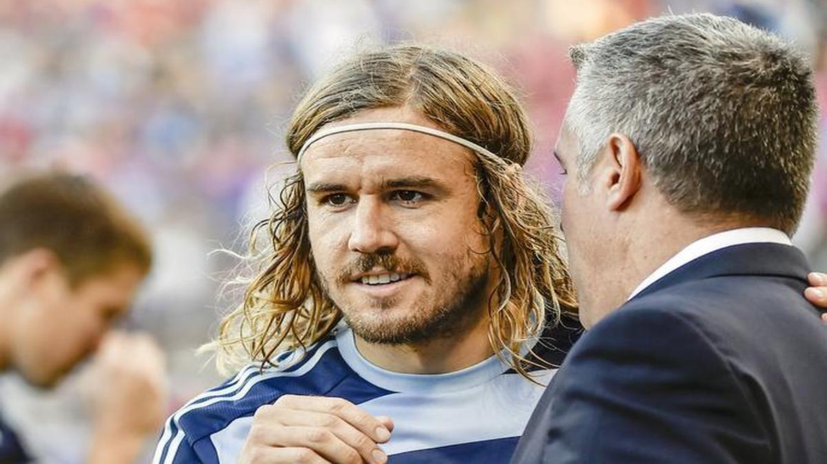 Sporting Kansas City’s Chance Myers was happy to get the start from his coach Peter Vermes (right).
