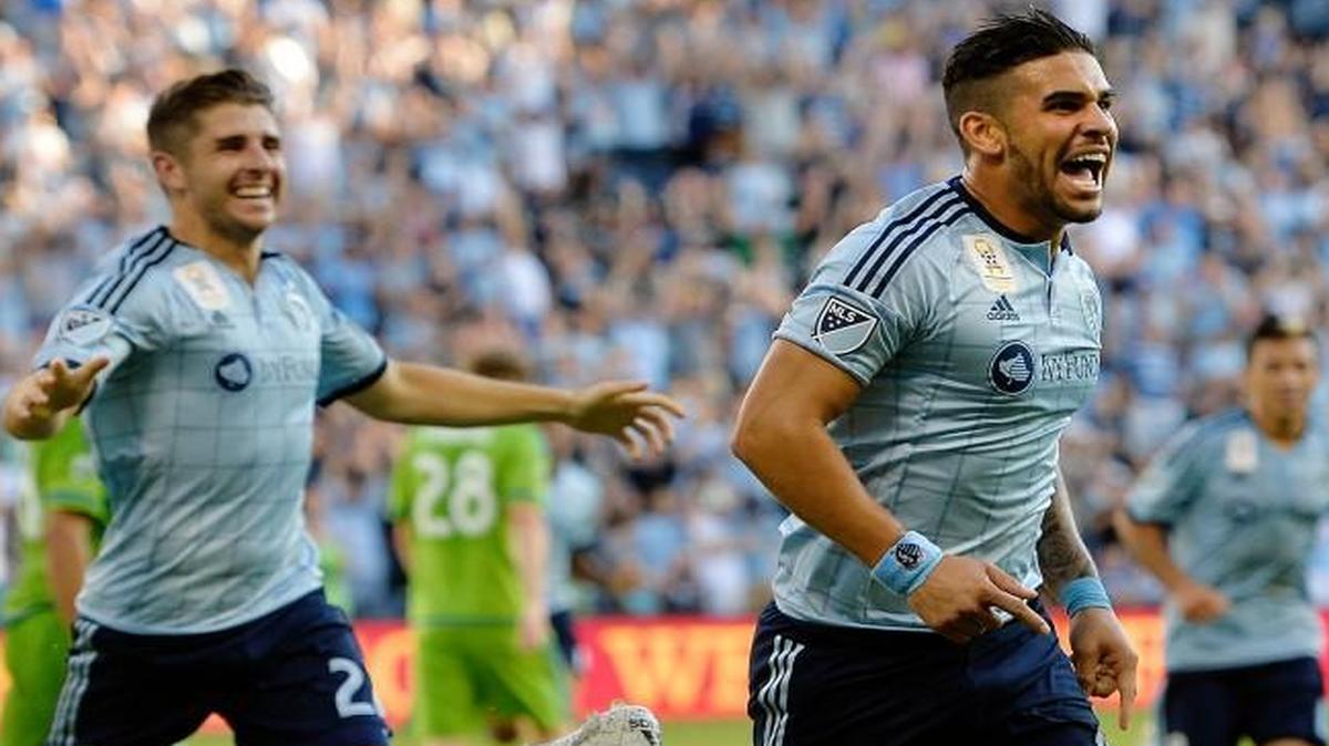
Sporting Kansas City’s Connor Hallisey (left) and Dom Dwyer celebrated Dwyer’s second-half that gave Sporting a 1-1 draw with the Seattle Sounders FC in MLS action on Sunday at Sporting Park.
