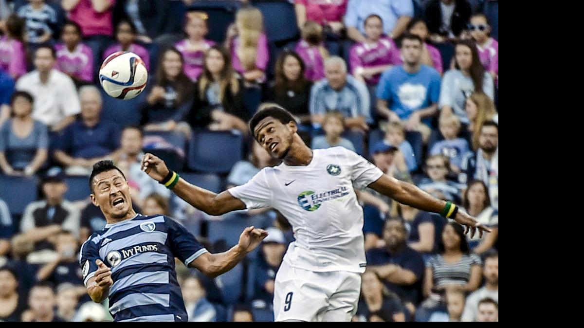 
Sporting Kansas City midfielder Roger Espinoza (left) and Saint Louis FC forward Jeremy Lynch battled during a Lamar Hunt U.S. Open Cup game June 16 at Sporting Park.

