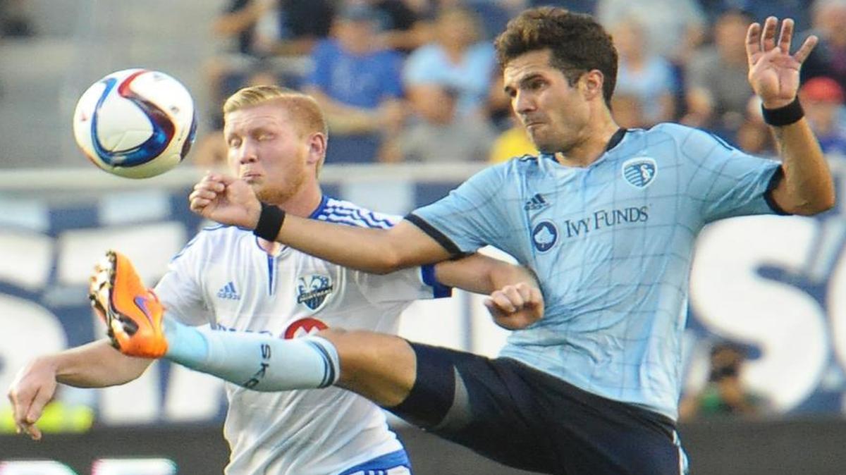 
Sporting Kansas City’s Benny Feilhaber (left) battled with Montreal’s Calum Mallace for control of the ball as the teams played Saturday night at Sporting Park. Feilhaber had a goal and an assist as Sporting beat the Impact 2-1.
