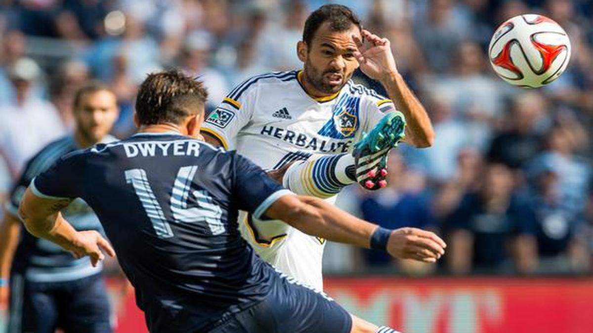 
Dom Dwyer (14) of Sporting Kansas City and Juninho (19) of the Los Angeles Galaxy competed for the ball as the teams played Saturday at Sporting Park. Sporting KC won the match 2-1.
