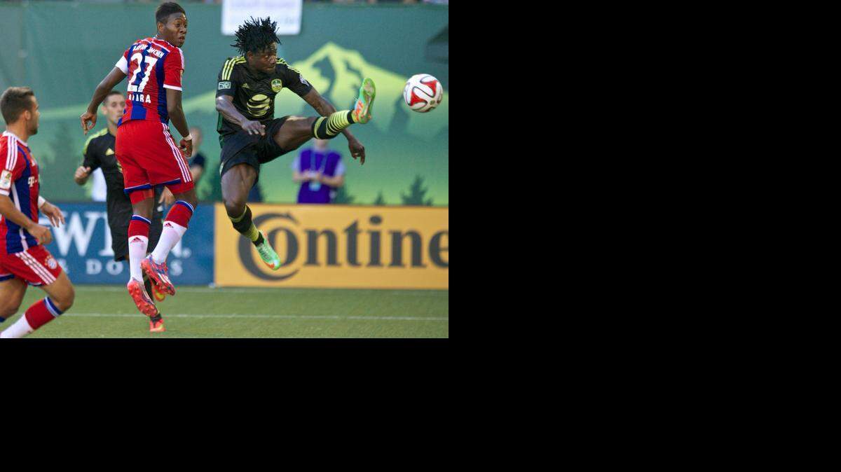 
MLS All-Stars forward Obafemi Martins (right), of the Seattle Sounders, made a shot on goal against Bayern Munich in the first half of the MLS All-Star Game on Wednesday night in Portland, Ore. 
