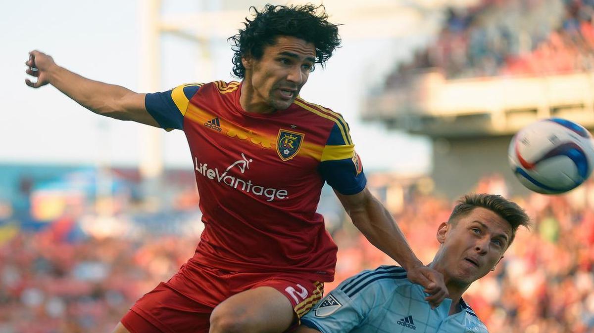 
Real Salt Lake defender Tony Beltran (2) battled Sporting KC forward Krisztian Nemeth on Sunday night in Sandy, Utah. Real Salt Lake scored in the last minute to win the match 2-1.
