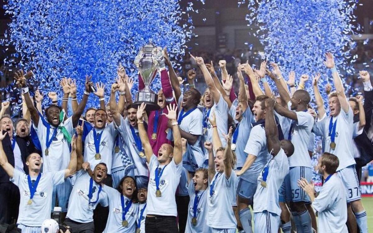 Sporting Kansas City celebrated with the trophy after beat Seattle and taking the Lamar Hunt US Open Cup championship in 2012.