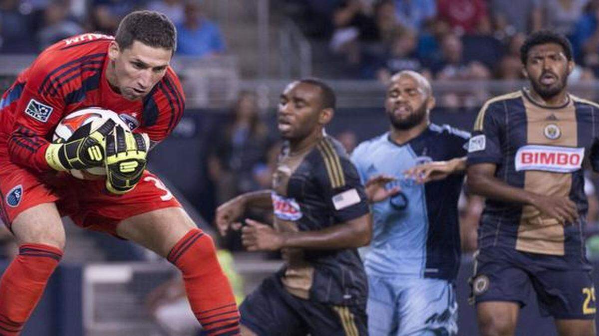
Sporting KC goalkeeper Andy Gruenebaum (30) grabbed a shot out of the air as Philadelphia Union defender/midfielder Amobi Okugo (14), Sporting KC defender Kevin Ellis (4) and Philadelphia Union defender Sheanon Williams (25) watched as the two teams played to a 1-1 draw Aug. 1 at Sporting Park. Sporting plays the New England Revolution on Wednesday night in Foxborough, Mass.
