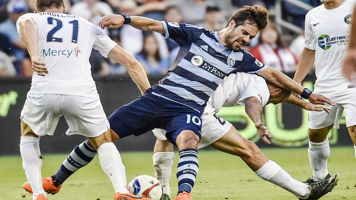 
Sporting Kansas City midfielder Benny Feilhaber (10) was sandwiched between Saint Louis FC defender Chad Vandergriffe (21) and midfielder Brandon Barklage (25) during Tuesday soccer match in the Lamar Hunt U.S. Open Cup competition at Sporting Park. Sporting KC won 1-0.
