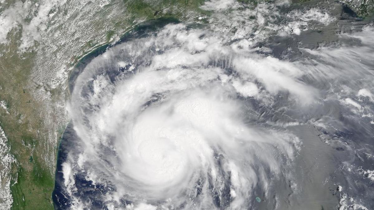 This satellite image provided by NASA on Thursday, Aug. 24, 2017 shows Hurricane Harvey off the Gulf of Mexico. Harvey intensified as it steered toward the Texas coast on Friday, with forecasters saying it had strengthened to a Category 2 storm with the potential to swamp communities more than 100 miles (161 kilometers) inland.