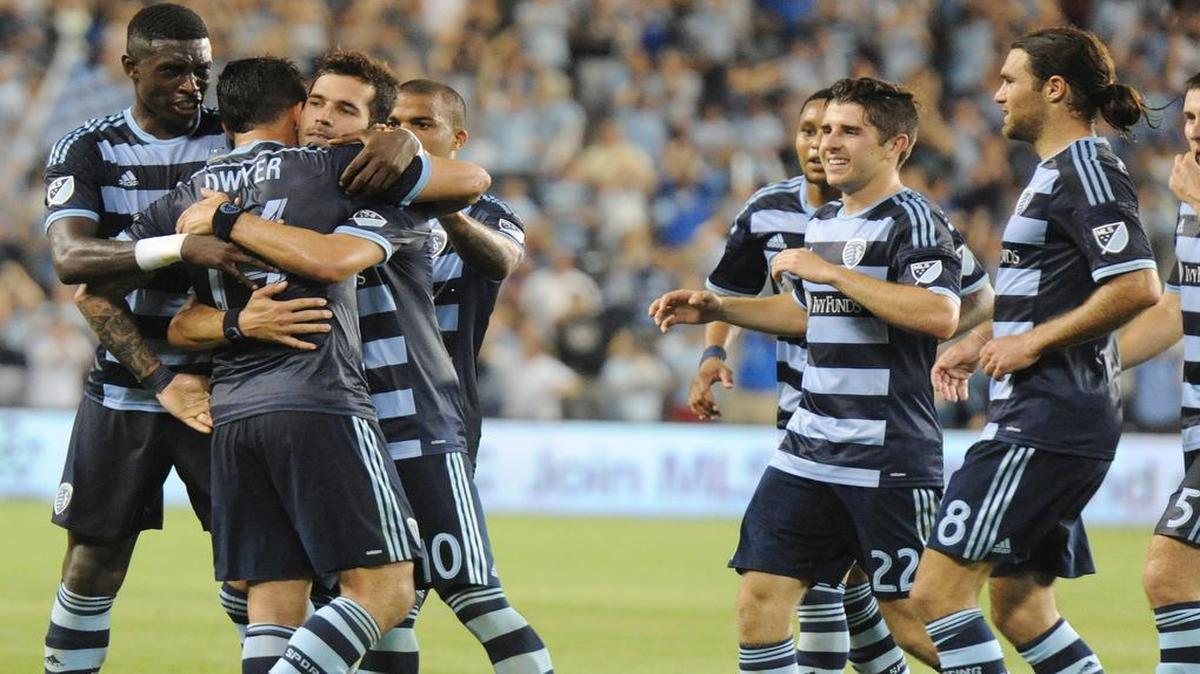 
Sporting Kansas Dominic Dwyer hugged teammate Benny Feilhaber after Feilhaber scored on a penalty kick that proved to be the winning goal in Sporting’s 1-0 victory over the Seattle Sounders on Saturday night at Sporting Park. The penalty was called when Seattle goalkeeper Stefan Frei collided with Feilhaber.

