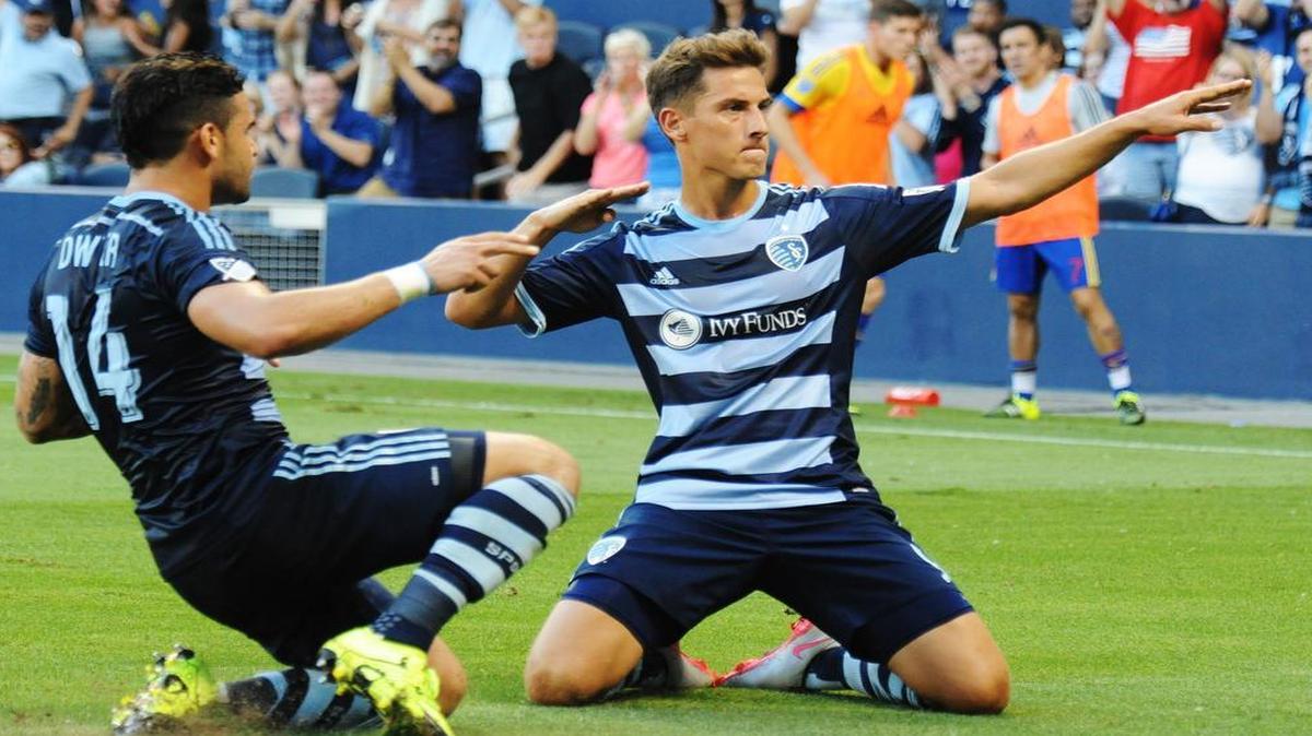 
Sporting KC’s Dom Dwyer (left) join teammate Krisztian Nemeth as they celebrate the first goal of Saturday’s game, made by Nemeth, against the Colorado Rapids.
