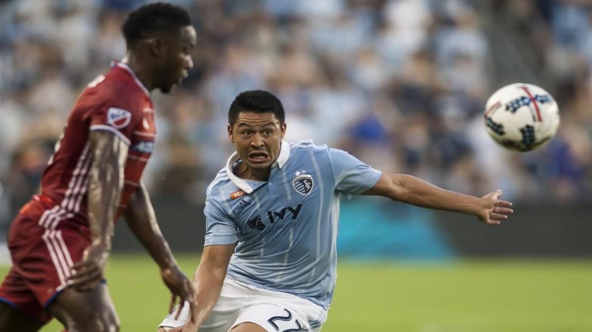Sporting Kansas City midfielder Roger Espinoza, right, attempts to chase down the ball during a 2018 game against FC Dallas at Children’’s Mercy Park.