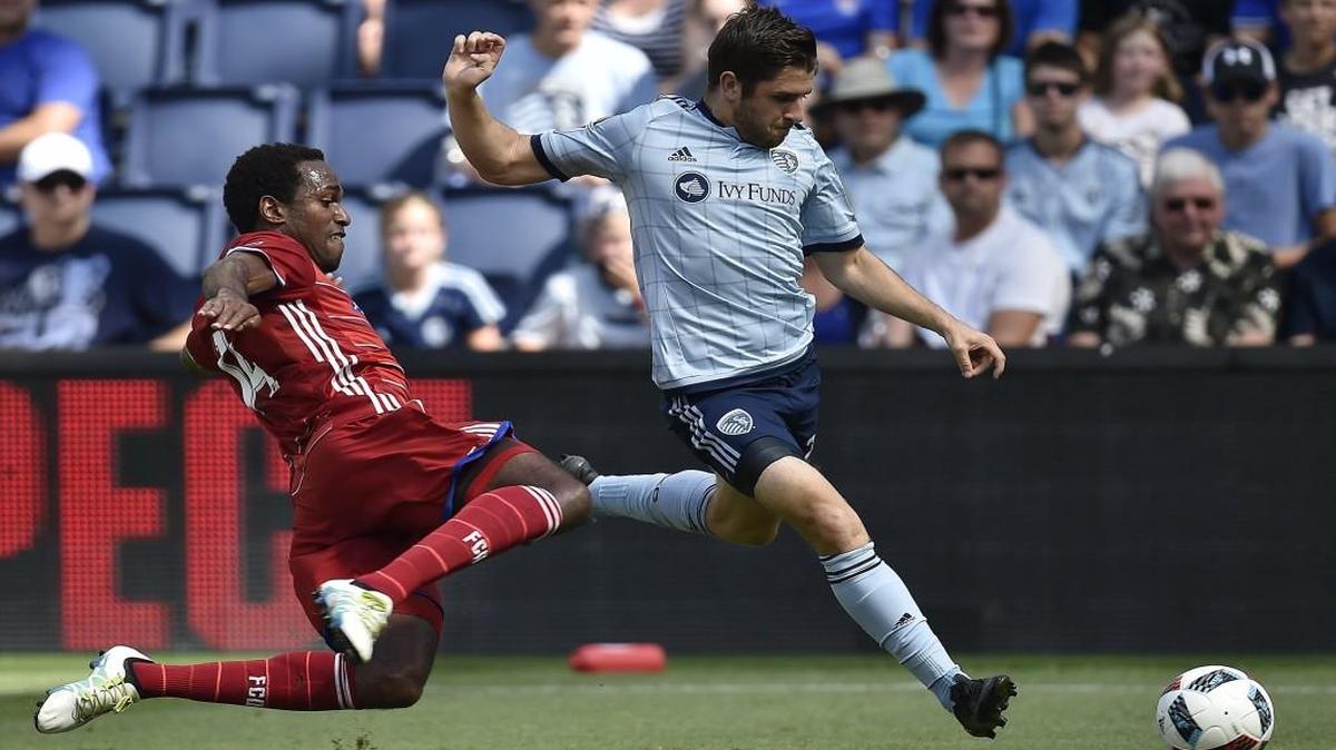 Benny Feilhaber (right) drove the ball past Dallas FC’s Atiba Harris in the first half of Sporting’s 2-0 win on Sunday at Children’s Mercy Park. Feilhaber and Sporting defender Saad Abdul-Salaam were named to the MLS team of the week Monday.