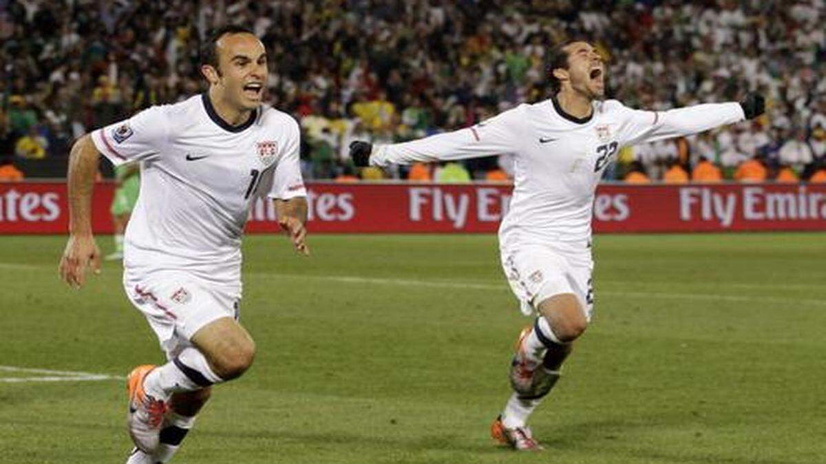 The United States’ Landon Donovan (center) celebrated with Benny Feilhaber (right) after scoring the game-winning goal to beat Algeria during the 2010 World Cup in South Africa.