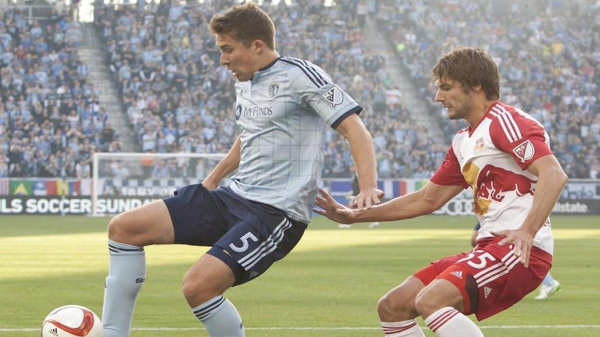 
Sporting Kansas City’s Matt Besler attempted to gain possession of the ball against Damien Perrinelle of the RedBulls during their match in March at Sporting Park.
