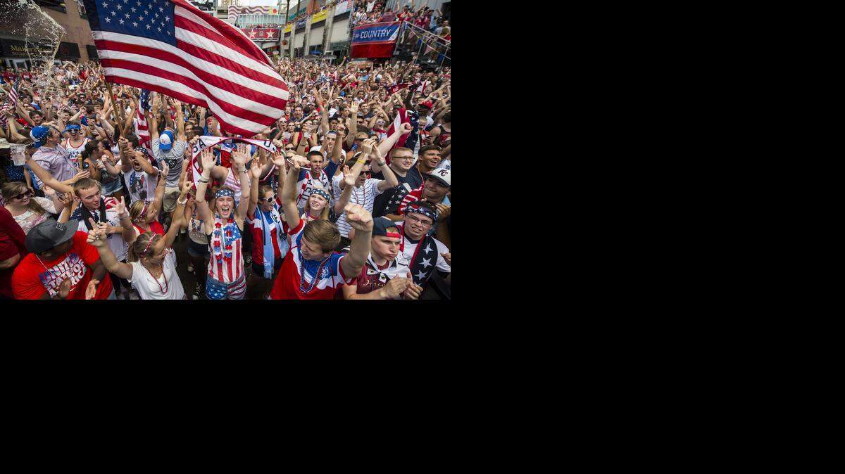 
Meghan Kennedy of Leawood, Kansas, lower center, celebrated with thousands of soccer fans in the Power & Light District in downtown Kansas City, Mo., as the United States advanced on points in World Cup Group G action on Thursday morning, despite losing to Germany 1-0.
