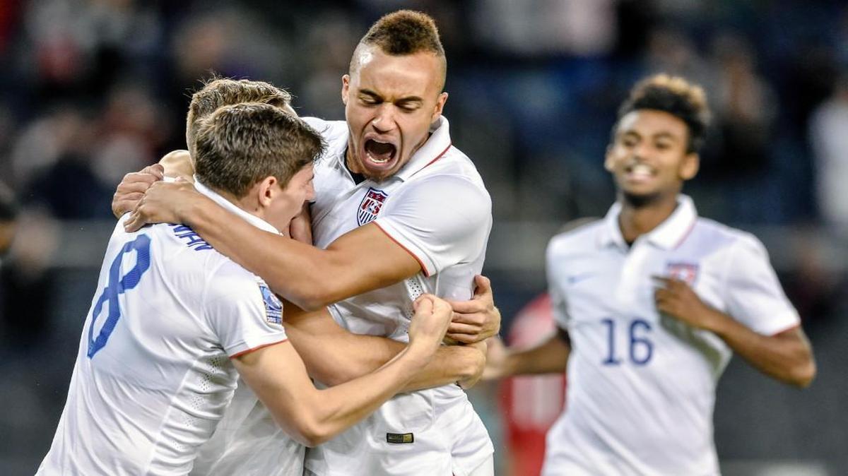 
USA midfielder Emerson Hyndman (8) and USA forward Jerome Kiesewetter (17) celebrated USA forward Jordan Morris (9) goal against Canada on Thursday during the 2015 CONCACAF Men's Olympic Qualifying Championship rounds at Sporting Park.
