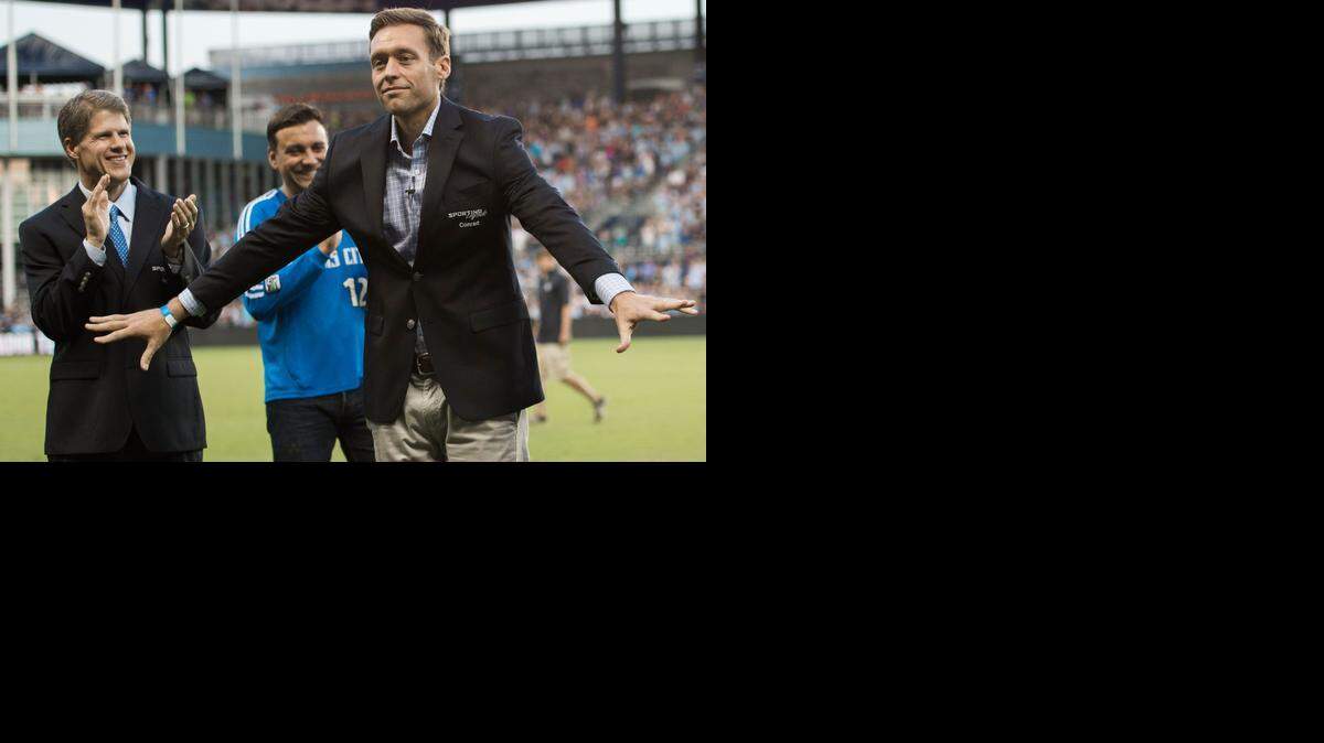 
Representing his father Lamar Hunt, Clark Hunt (left), joined Sporting Kansas City Owner Rob Heineman in applauding Jimmy Conrad as Conrad preened for the crowd as he, Hunt and Sporting head coach Peter Vermes were inducted into the Sporting Legends during a half-time ceremony in the Sporting Kansas City and Philadelphia Union Major League Soccer match at Sporting Park on Friday, August 1, 2014, in Kansas City, Kansas.
