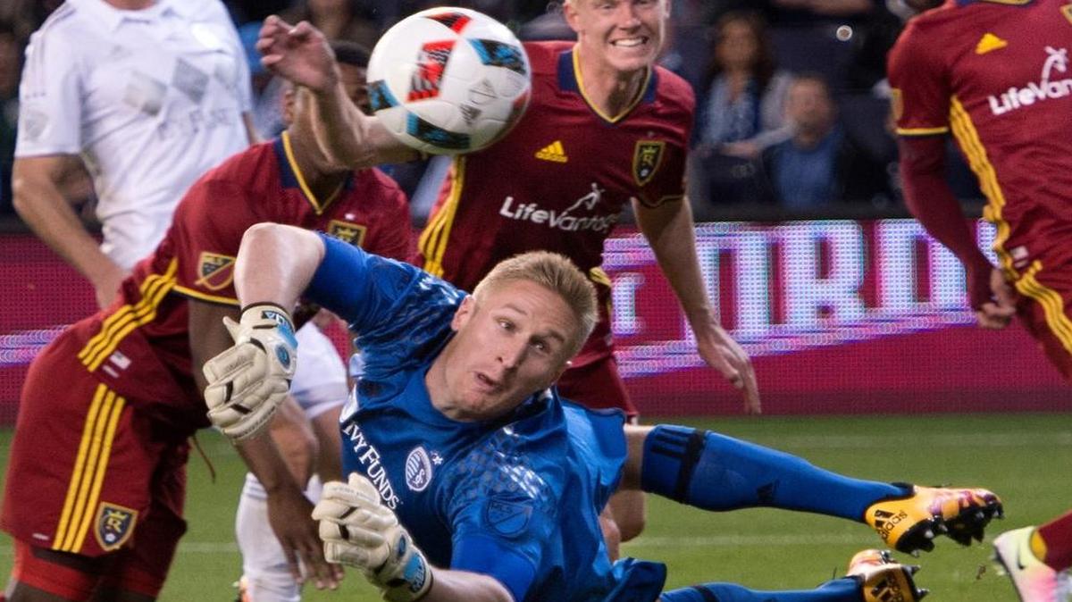 Real Salt Lake defender Justen Glad (back center) kicked the ball past Sporting Kansas City goalkeeper Tim Melia to score a goal in the first half Saturday at Children’s Mercy Park.