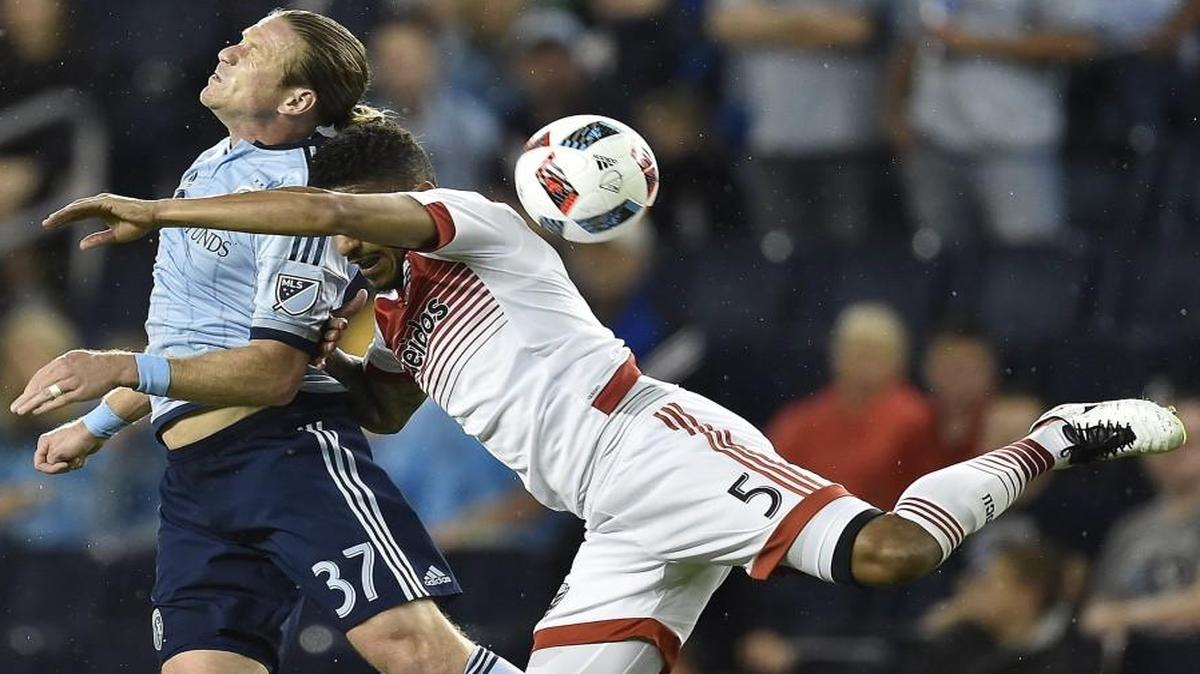 Sporting Kansas City forward Jacob Peterson (left) collided with DC United’s Sean Franklin collide while heading the ball when the two clubs met May 27 at Children’s Mercy Park. Sporting begins the second half of the MLS season when it hosts the Columbus Crew SC on Sunday at Children’s Mercy Park. “This is our chance to make a move,” Peterson said of the matches ahead.