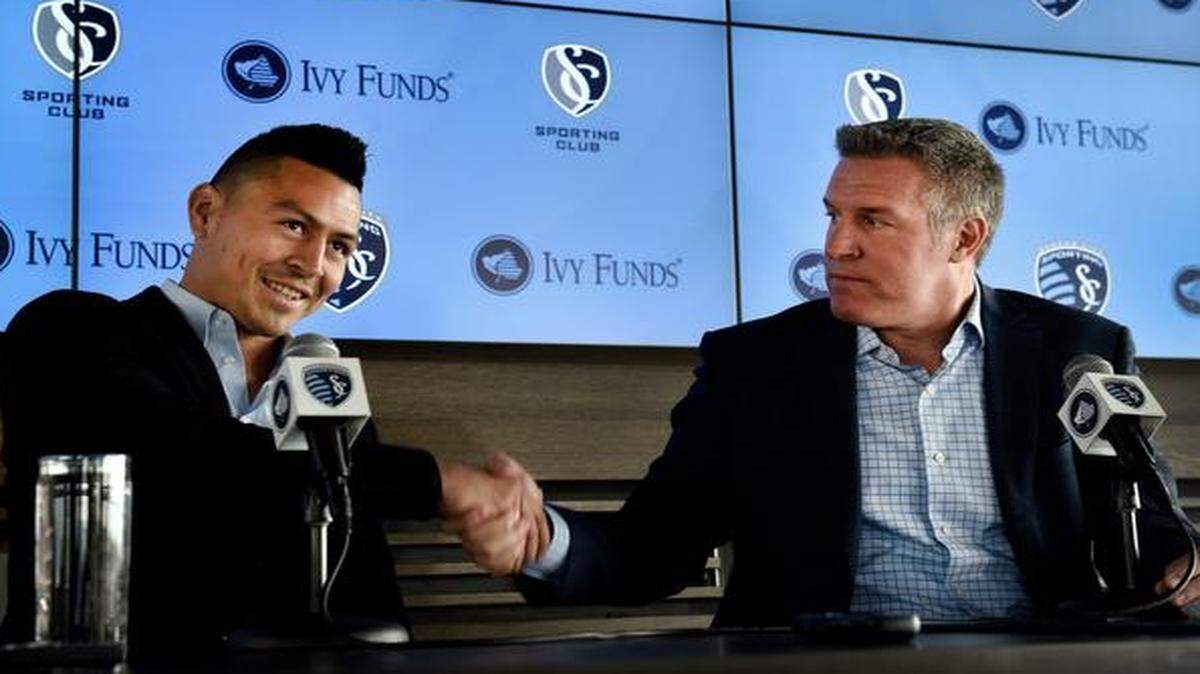 
Midfielder Roger Espinoza (left) was congratulated by Sporting Kansas City coach Peter Vermes during a Tuesday press conference in Kansas City. “I'm thrilled to be back in Kansas City,” Espinoza said. “I always knew I would come back some day and I could not be more excited to re-join this club.”
