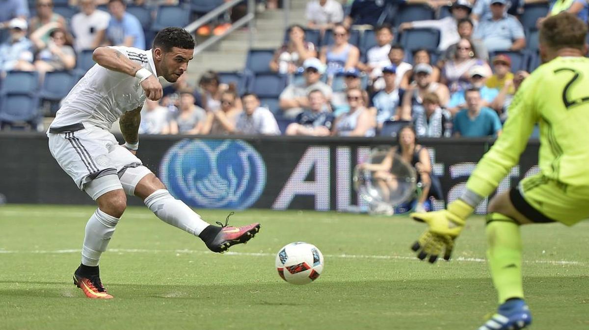 Sporting Kansas City striker Dom Dwyer scored a goal on this shot against Seattle goalkeeper Stefan Frei during a game in July. Dwyer scored one in each half as Sporting KC defeated Seattle 3-0.