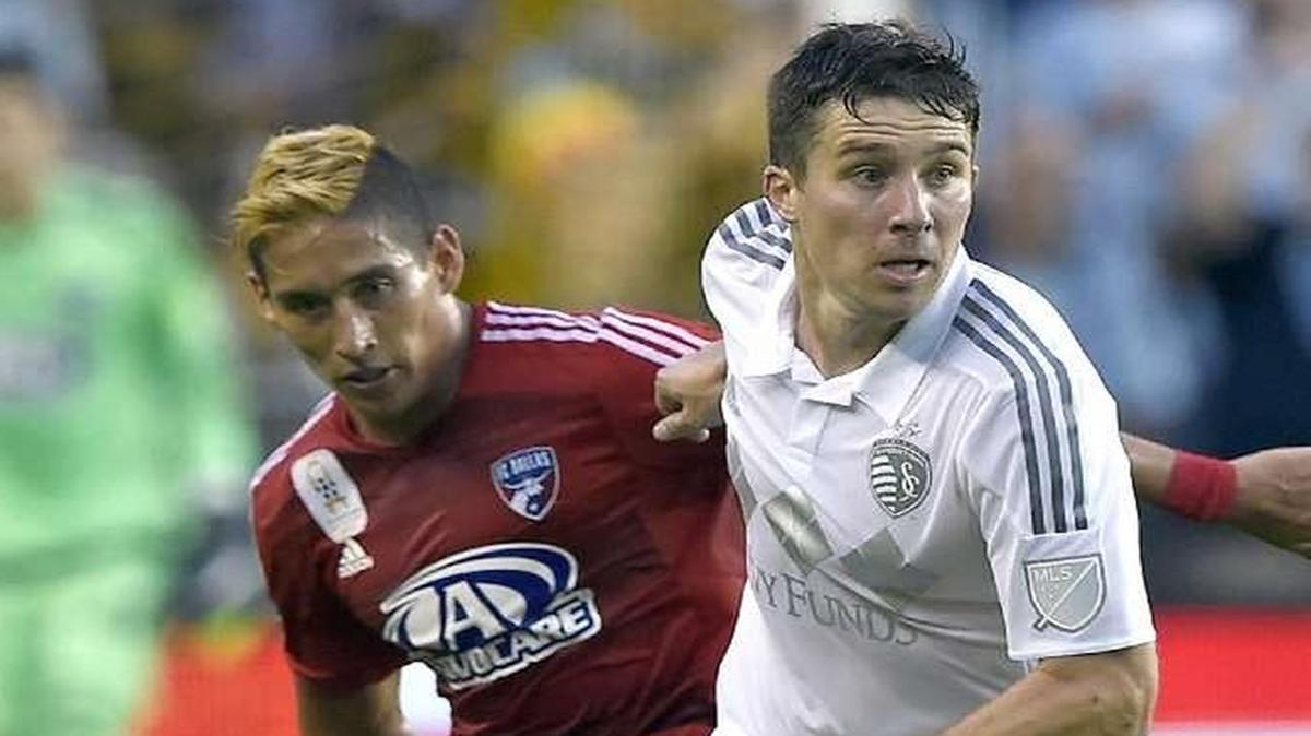 Sporting KC defender Matt Besler (5) keeps the ball away from FC Dallas forward David Texeira (9) during Friday's Major League Soccer game on September 18, 2015 at Sporting Park in Kansas City, Kan.
