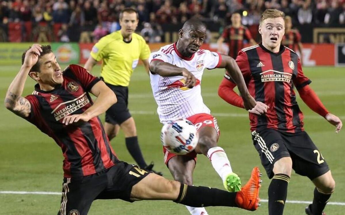 Red Bulls striker Bradley Wright-Phillips (center) scored a goal against Atlanta United RC’s Carlos Carmona (left) during a game in March.