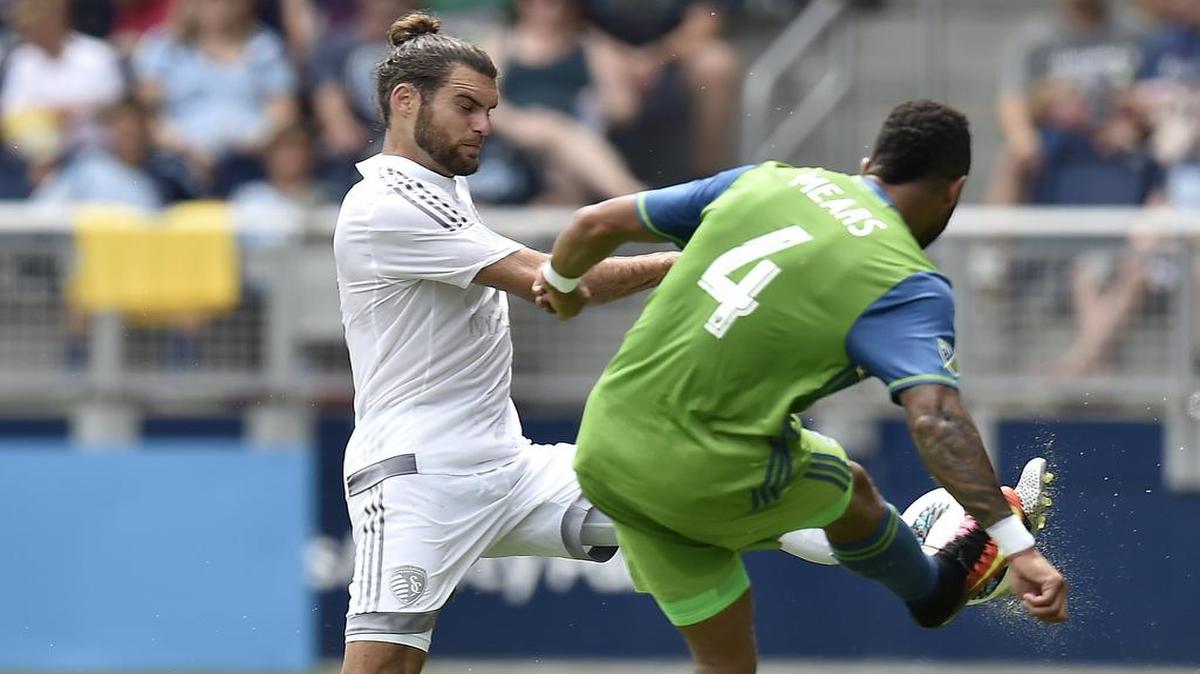 Sporting KC’s Graham Zusi (left) and Seattle’s Tyrone Mears battled for the ball during a match at Children’s Mercy Park in July. Zusi has made just seven appearances since May 21.