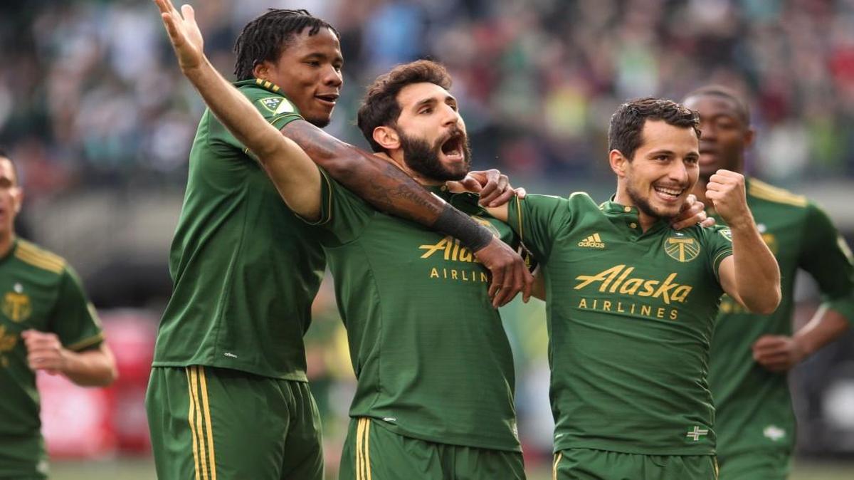 Portland’s Diego Valeri (8) celebrates after scoring a goal in the first half against the New England Revolution on April 2.
