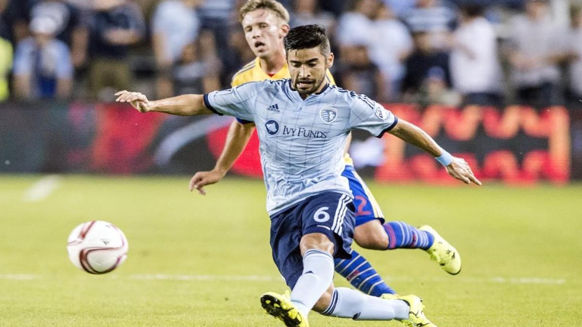 Sporting Kansas City midfielder Paulo Nagamura kicks the ball away from the Colorado Rapids’ defense during a match last fall.