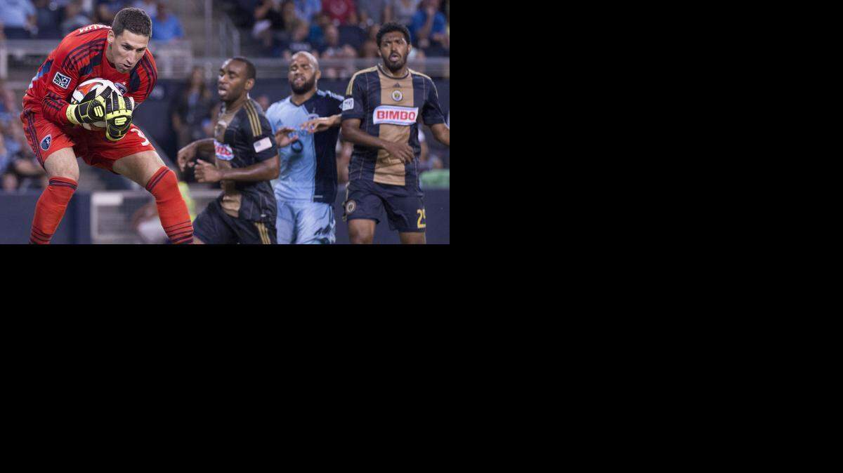 
Sporting KC goalkeeper Andy Gruenebaum (30) grabbed a shot out of the air during a match against the Philadelphia Union in 2014. Gruenebaum is one of three former SKC players available in the Major League Soccer re-entry draft on Friday. 



