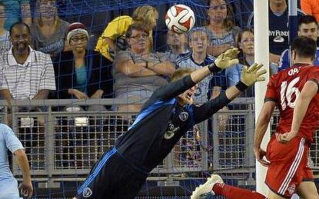 
Sporting Kansas City and Toronto FC played to a 2-2 tie on Friday, May 23, 2014, at Sporting Park in Kansas City, Kan. Sporting goalie Eric Kronberg couldn’t stop a goal near the end of the match by Bradley Orr (right) of Toronto, tying the score.
