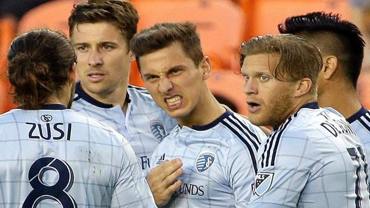 
Sporting Kansas City’s Krisztian Nemeth (center) celebrated with teammates after scoring a goal against the Dynamo in the first half Saturday night in Houston. 
