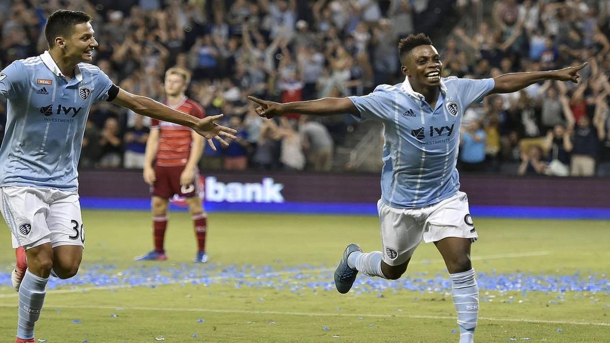 Latif Blessing (9) and Daniel Salloi (30) celebrated after Blessing scored his second goal in extra time against FC Dallas in the U.S. Open Cup quarterfinals on Tuesday, July 11, 2017 at Children’s Mercy Park in Kansas City, Kan. Salloi later scored the team's third, and Sporting defeated Dallas 3-0 in extra time play.