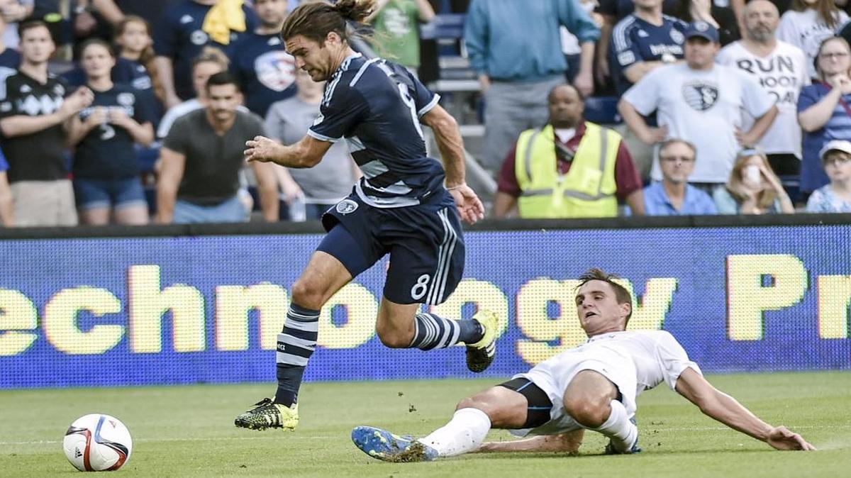 
Sporting Kansas City midfielder Graham Zusi (8) got around Saint Louis FC defender Sam Fink (3) in the Lamar Hunt U.S. Open Cup match Tuesday night at Sporting Park. Zusi scored the decisive goal as Sporting won 1-0.
