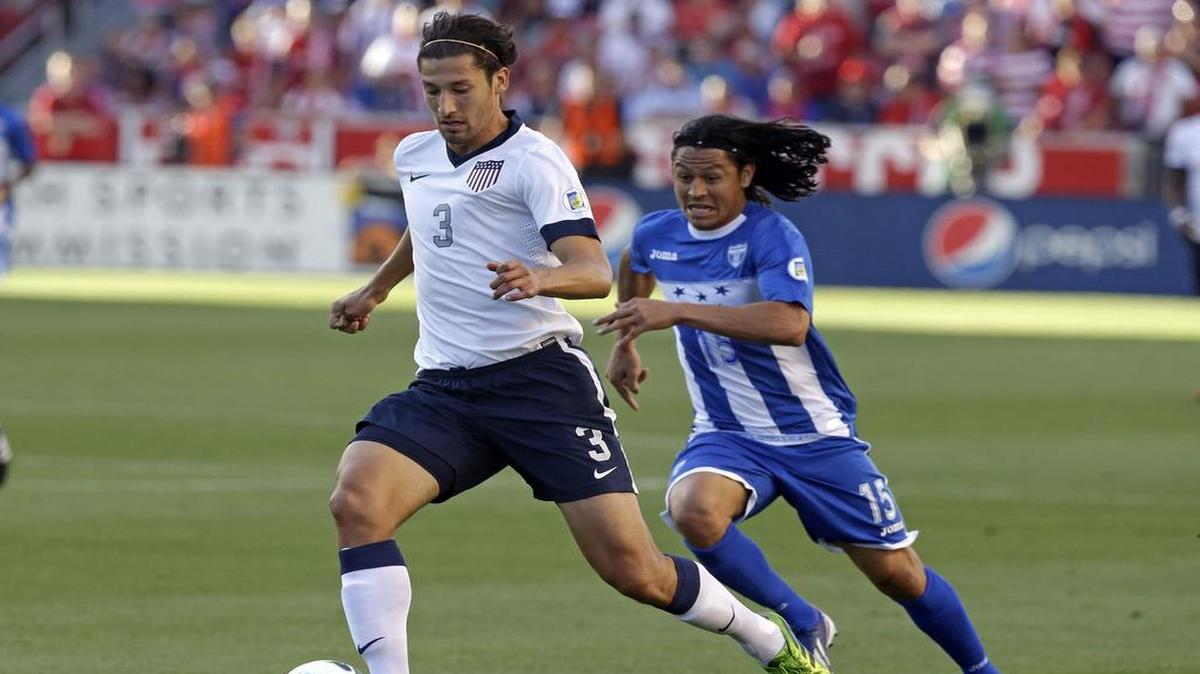 
Honduras’ Roger Espinoza (right) defended as Omar Gonzalez of the United States cleared the ball in the first half during a World Cup qualifying soccer match at Rio Tinto Stadium on June 18, 2013, in Sandy, Utah. 
