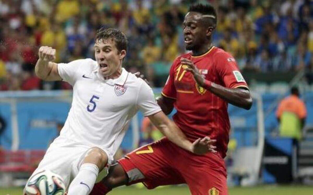 
Matt Besler of Sporting Kansas City and the U.S. men’s national team cleared the ball away from Belgium’s Divock Origi during the World Cup round of 16 soccer match Tuesday in Salvador, Brazil.
