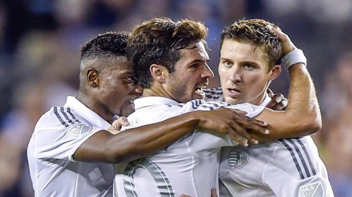 
Sporting Kansas City midfielder Benny Feilhaber (center) celebrated a goal with Matt Besler and Soni Mustivar during the team’s 3-1 win over the Houston Dynamo in a U.S. Open Cup quarterfinal game.
