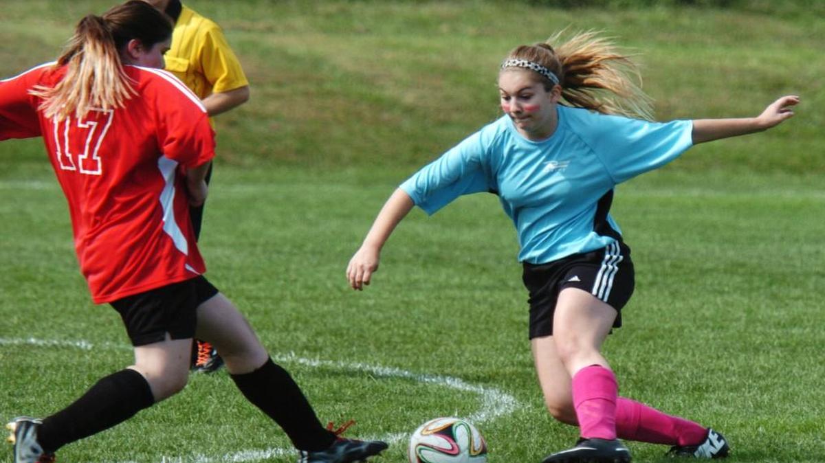 
Taylan Bassett of the Kansas Rush Blues dribbled the ball as Overland Park Red Hots’ Emelia Jarvi tried to steal the ball on Saturday.

