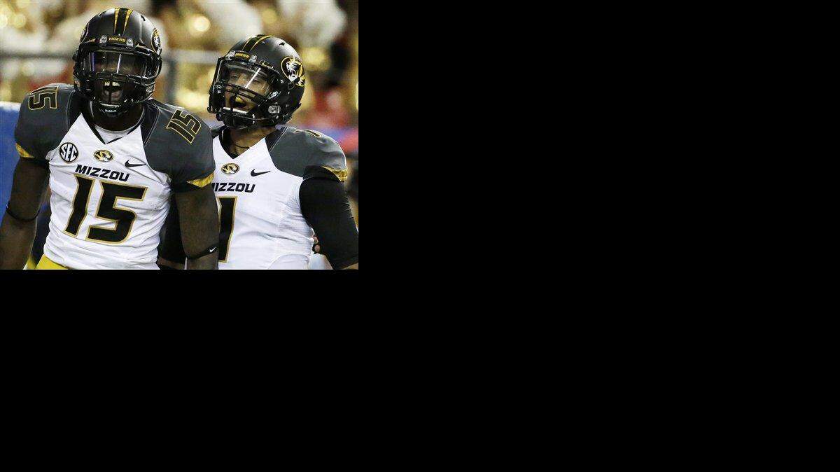 
Missouri wide receiver Dorial Green-Beckham (left) celebrated with Missouri quarterback James Franklin after Green-Beckham scored a touchdown against Auburn in the first half of the Southeastern Conference NCAA football championship game on Dec. 7 in Atlanta.

