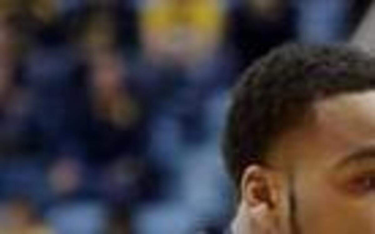
Kansas freshman guard Kelly Oubre Jr. (12) looked to pass while being defended by West Virginia guard Jaysean Paige on Feb. 16 in Morgantown, W.Va. 
