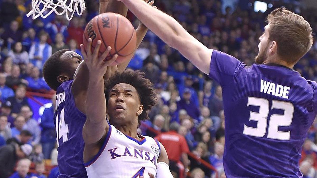 KU's Devonté Graham (center) scored 23 points in the Jayhawks’ 73-72 win over Kansas State on Saturday at Allen Fieldhouse.