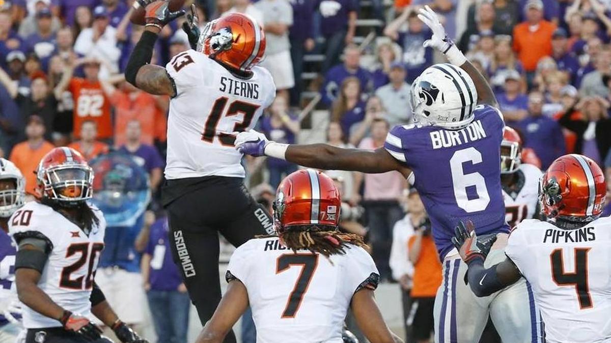 Oklahoma State safety Jordan Sterns intercepted a pass from K-State quarterback Jesse Ertz (16) intended for wide receiver Deante Burton (6) on Saturday. The play ended the game with Oklahoma State on top 43-37.