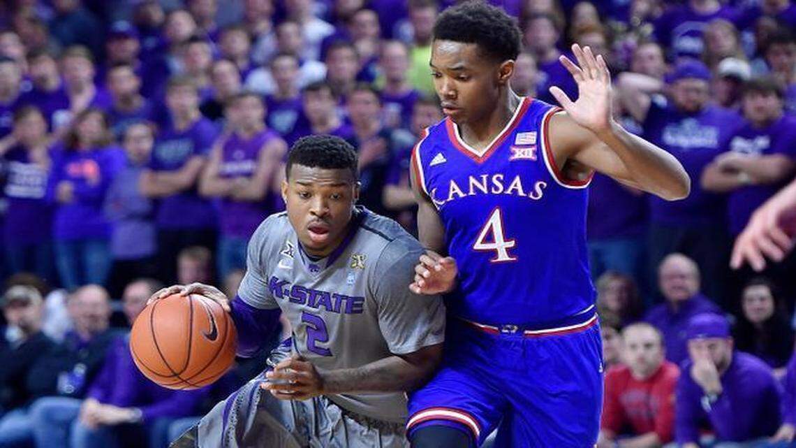 
Kansas State’s Marcus Foster (left) tried to drive by Kansas’ Devonte‘ Graham in the first half of the Wildcats’ 70-63 win over the Jayhawks on Feb. 23 at Bramlage Coliseum in Manhattan, Kan.
