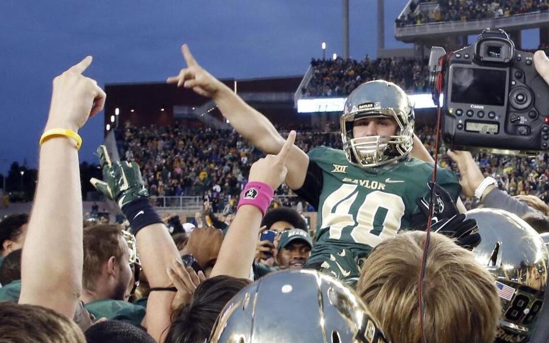 
Baylor kicker Chris Callahan was lifted high by his teammates after kicking the game-winning field goal against TCU last Oct. 11. The teams were co-Big 12 champions, but neither made the College Football Playoff.
