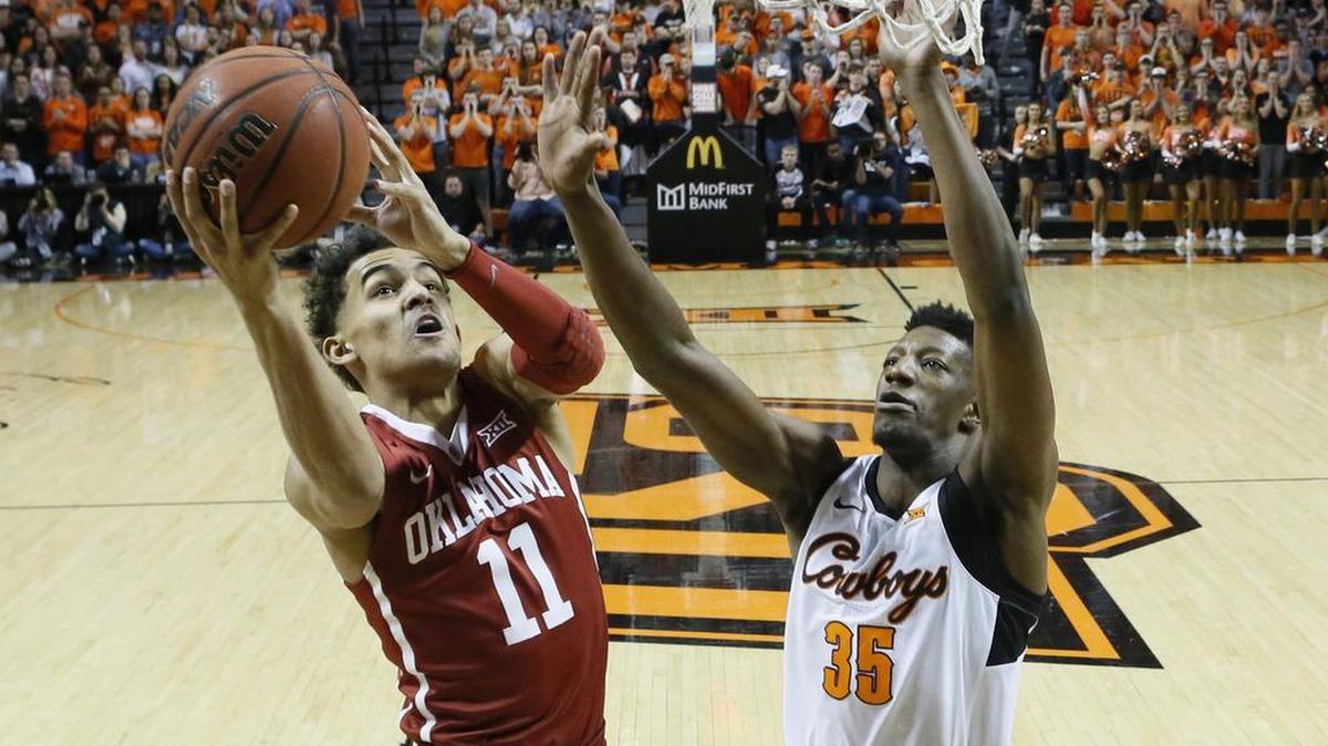 Oklahoma freshman guard Trae Young (left) scored 48 points against Oklahoma State on Saturday, but he took 39 shots in the Sooners’ 83-81 loss in overtime.